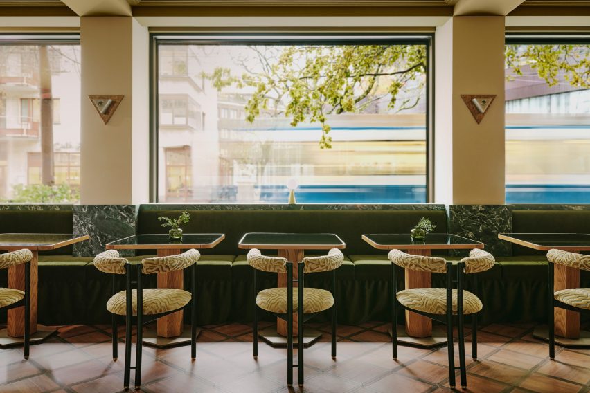 Restaurant seating area with windows looking out in Zurich hotel