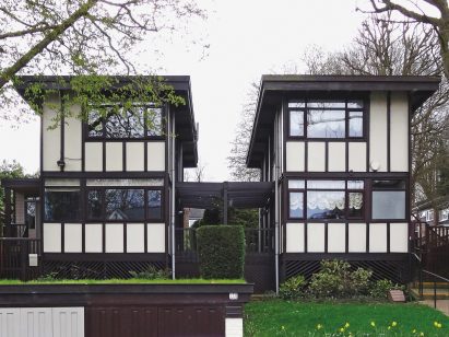 Black-and-white house built by Walter Segal's self-builders