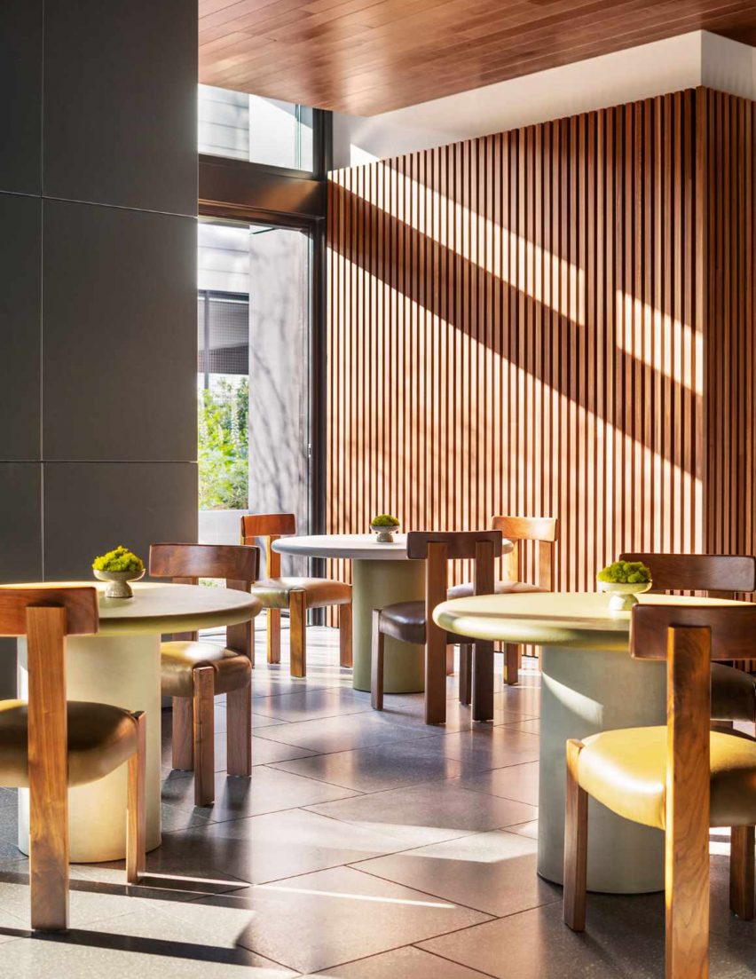 A room with dining tables and chairs