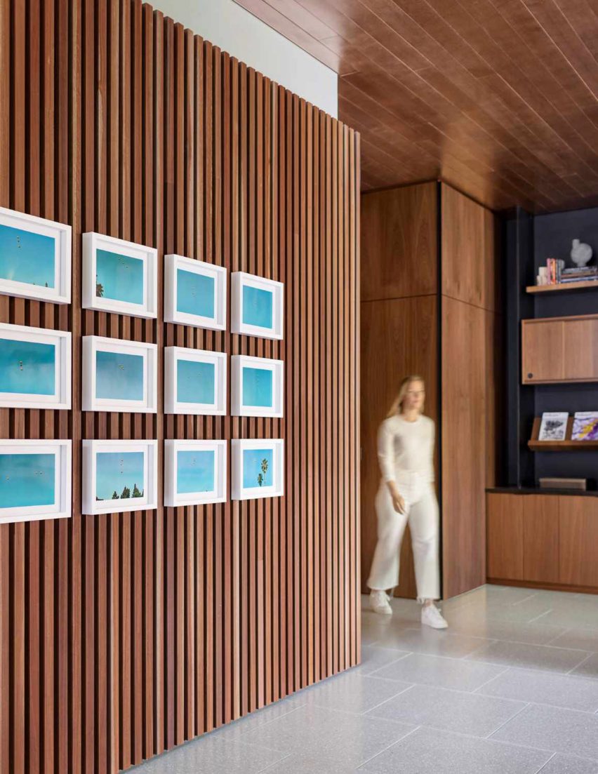 A room with wood clad siding