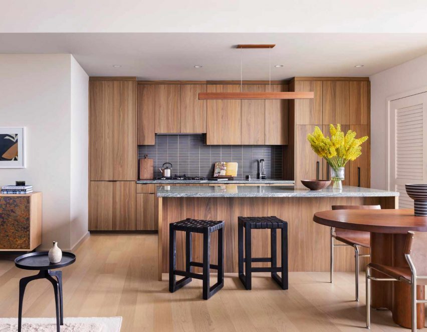 A kitchen with wooden cabintry