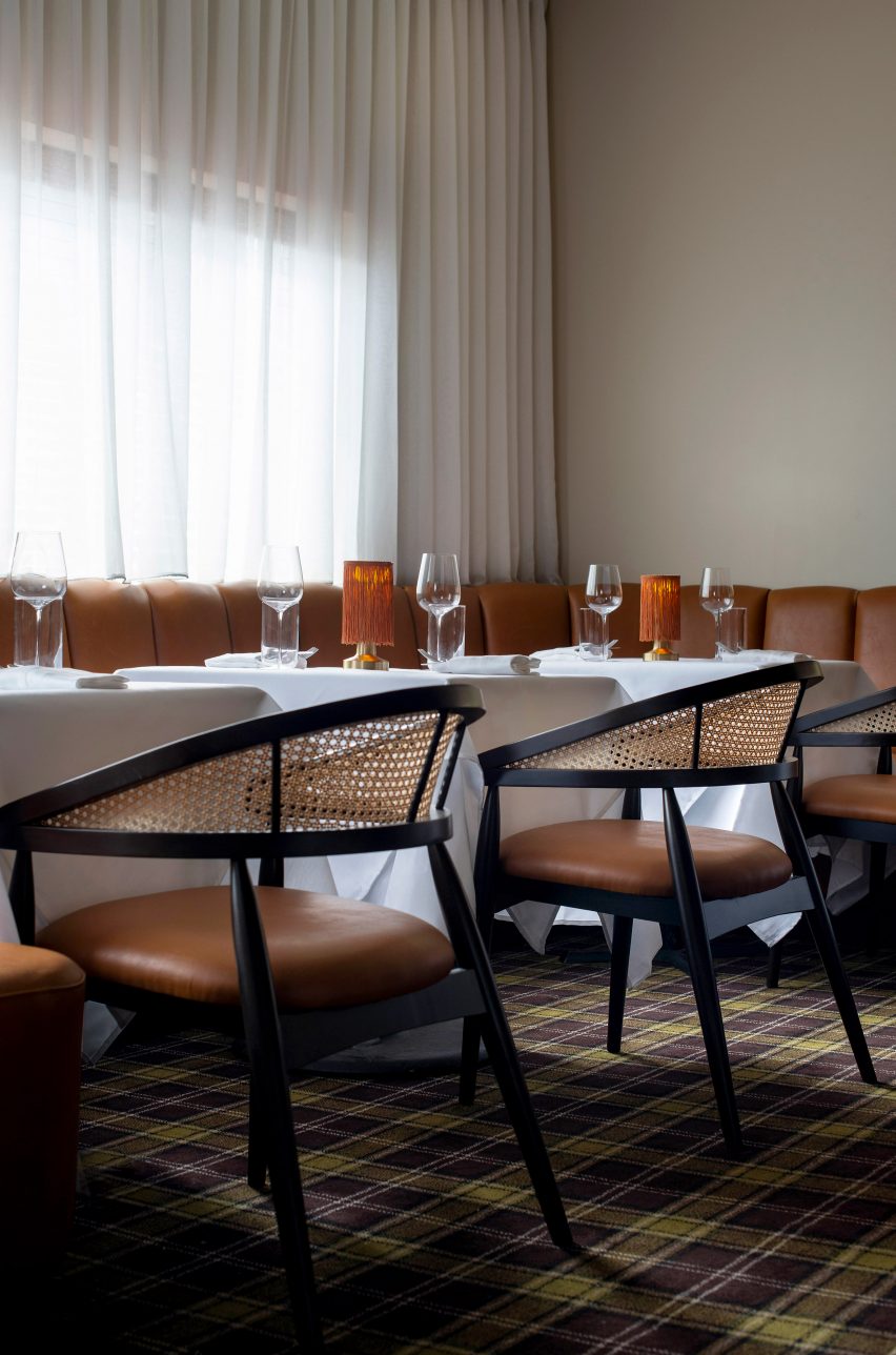 Tables and banquette seating at window