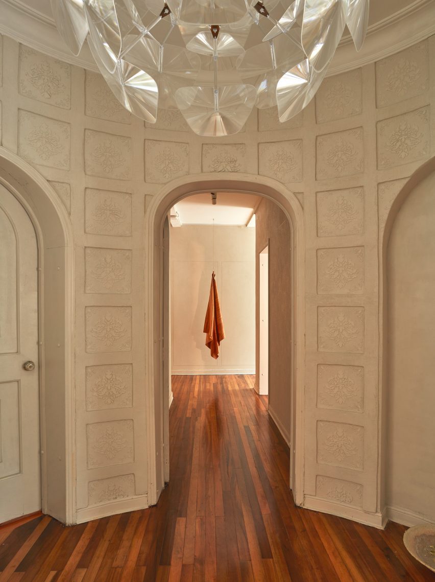 A hallway with printed concrete walls