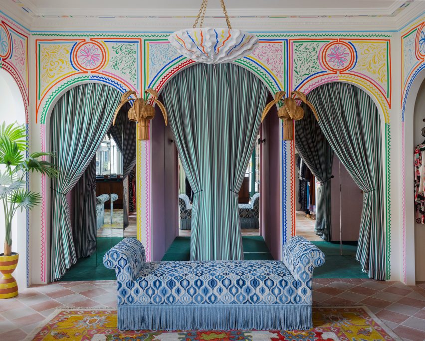 Blue patterned sofa and archways in London fashion store