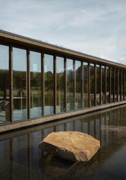 Glass corridor overlooking lake