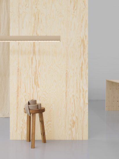 Wooden wall behind Superdupertube lamp