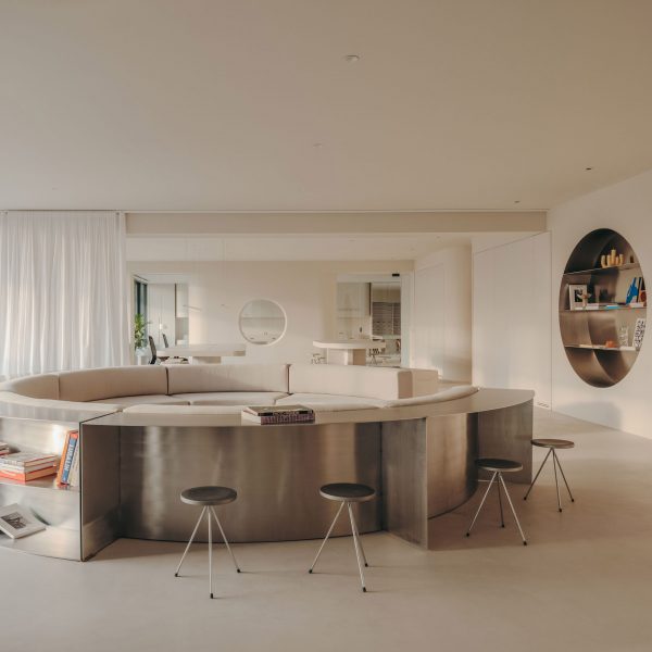 Circular sofa with stainless-steel frame in Gigi Studios office in Spain by Isern Serra