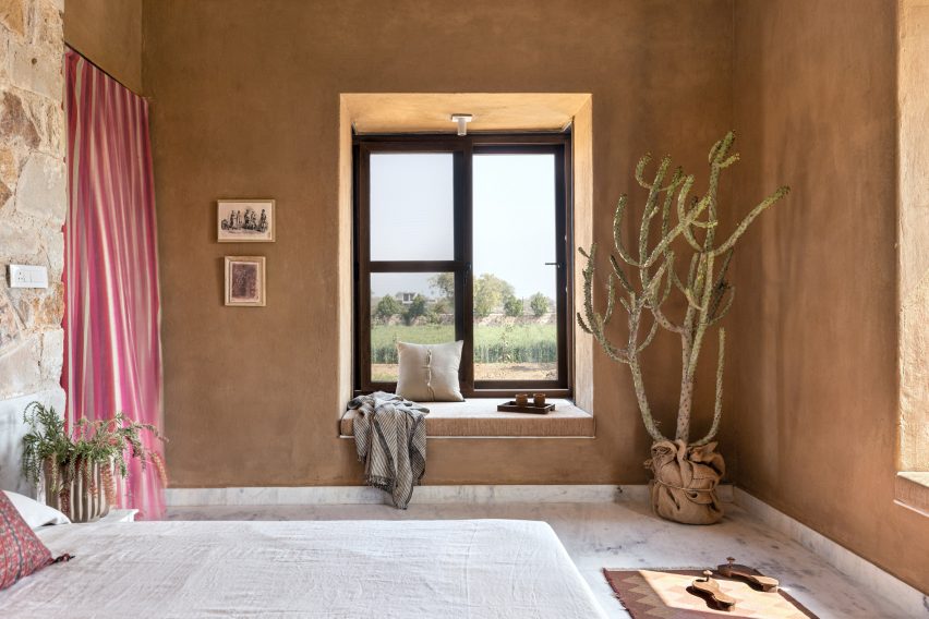 Window in bedroom wall with clay paint finish
