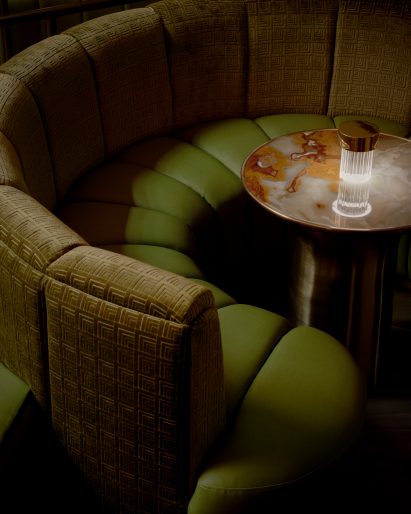 Patterned crushed velvet and leather banquette