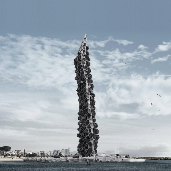 Tower rising up from a beach