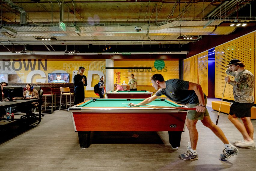 A student playing pool