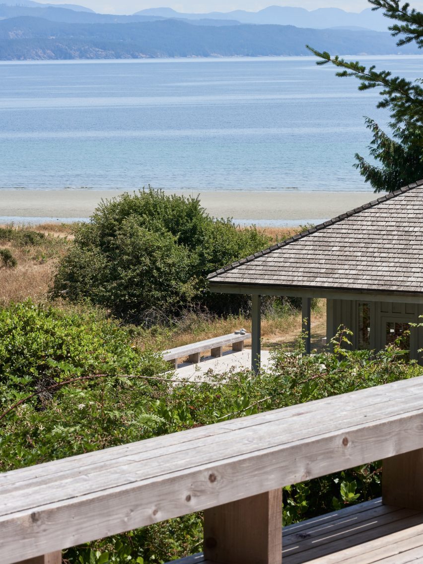 A cabin next to an ocean