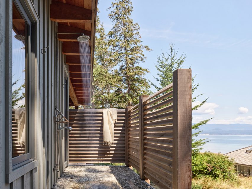 An outdoor shower enclosed with wooden slats
