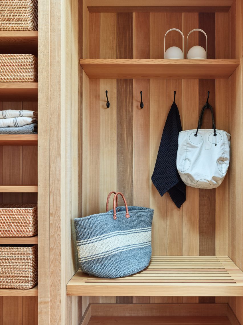 A built-in closet space with hooks