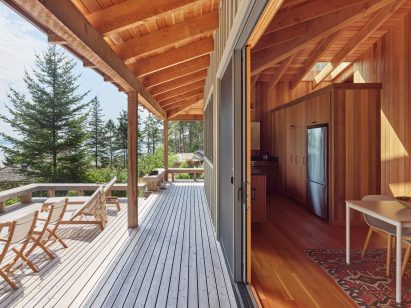 A cabin with large glass sliding doors