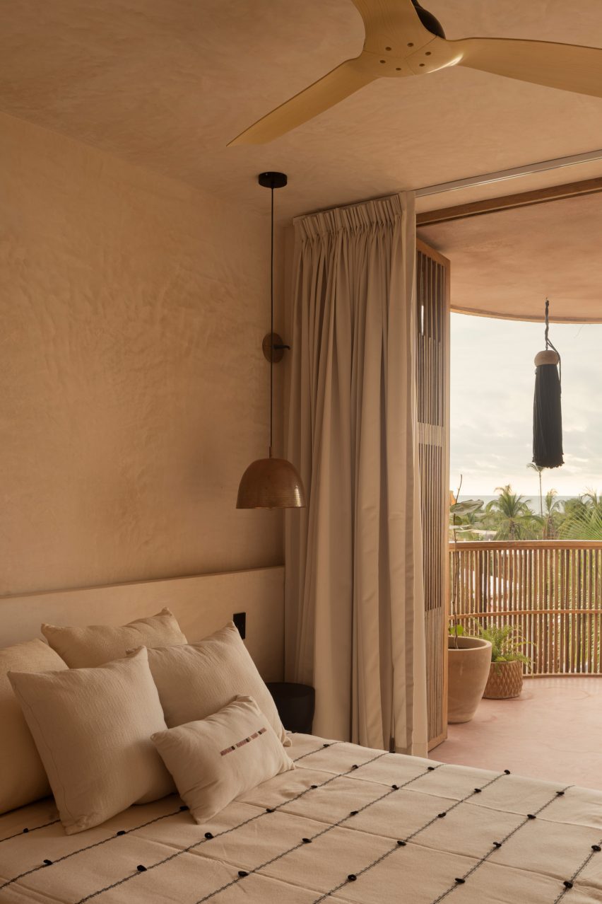 A bed next to curtain