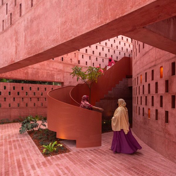 Women climbing up the spiral steel staircase of the Zebun Nessa Mosque by Studio Morphogenesis in Bangladesh