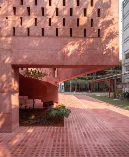 Close up of the pink concrete walls and mosaic floor of the Zebun Nessa Mosque by Studio Morphogenesis