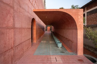 Outdoor ablution area with turquoise mosaic flooring of the Zebun Nessa Mosque by Studio Morphogenesis