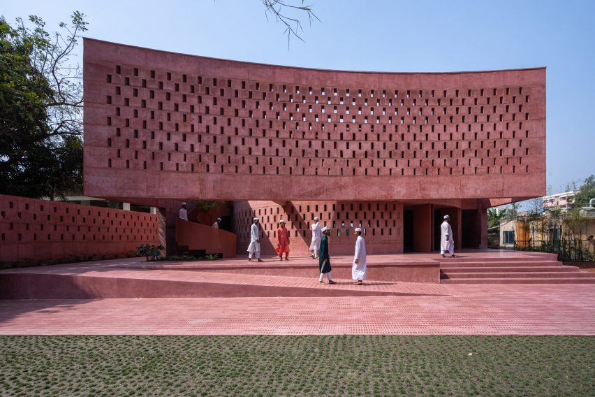 Visitors walking outside of Zebun Nessa Mosque by Studio Morphogenesis in Bangladesh