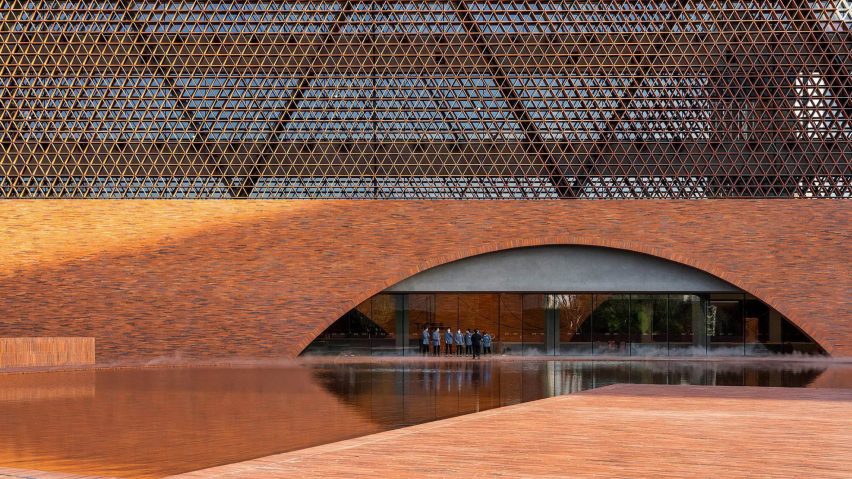 Brick exterior of hotel with curved arch