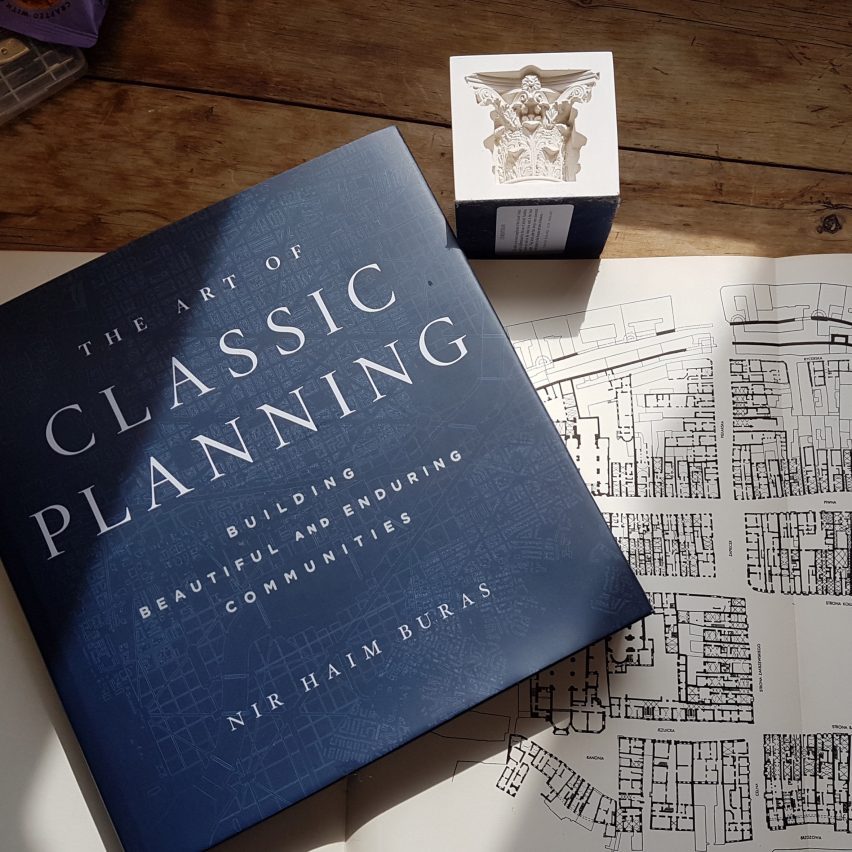 Desk display with book and plan drawing