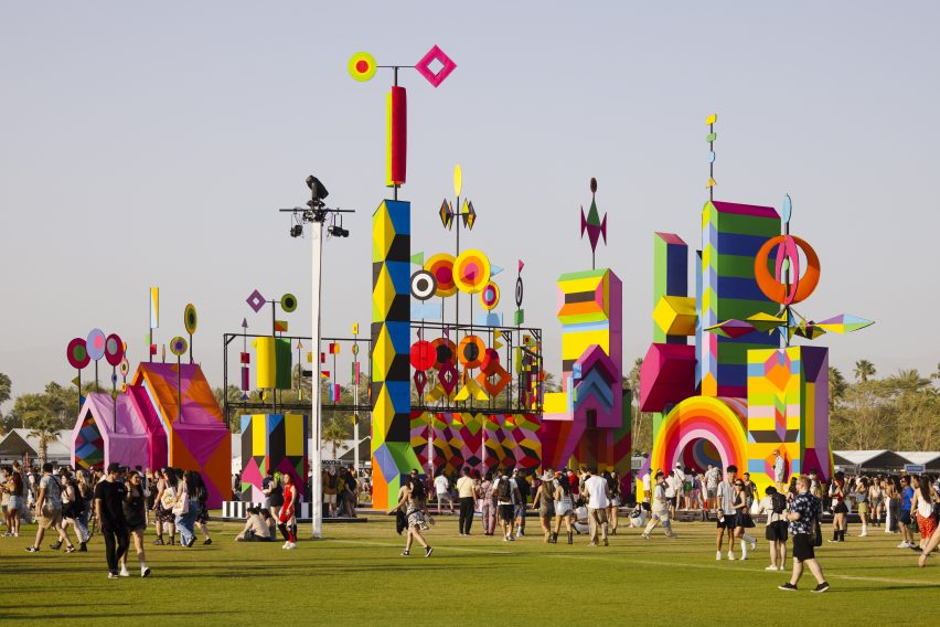 People walking around colorful installation
