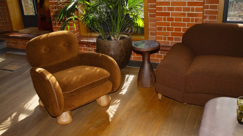 Photo of seating, a side table and a plant in a room