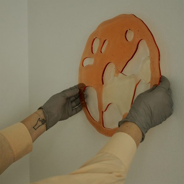 Photo of person holding a design object