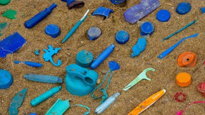 Photo of plastic collected during a community cleanup and sorted by colour.