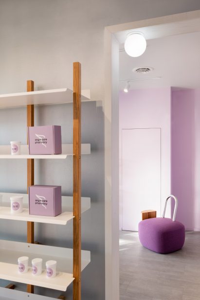 Display shelves in the foreground and a open doorway to another room