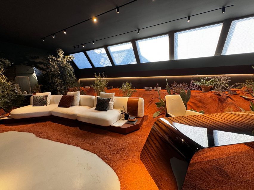 The desk and modular sofa were presented in a desert-like installation