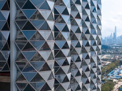 Curved vertical facade elements with triangular windows