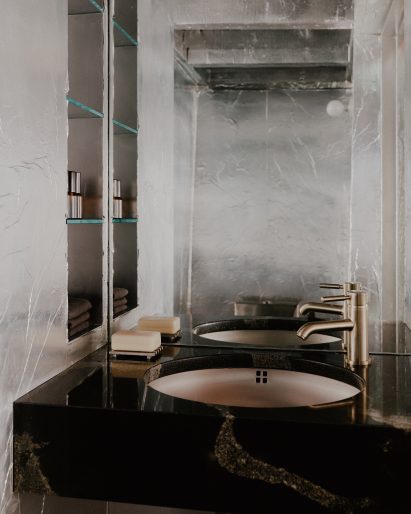 Bathroom with silver walls in Cubitts eyewear store in New York City by Tutto Bene