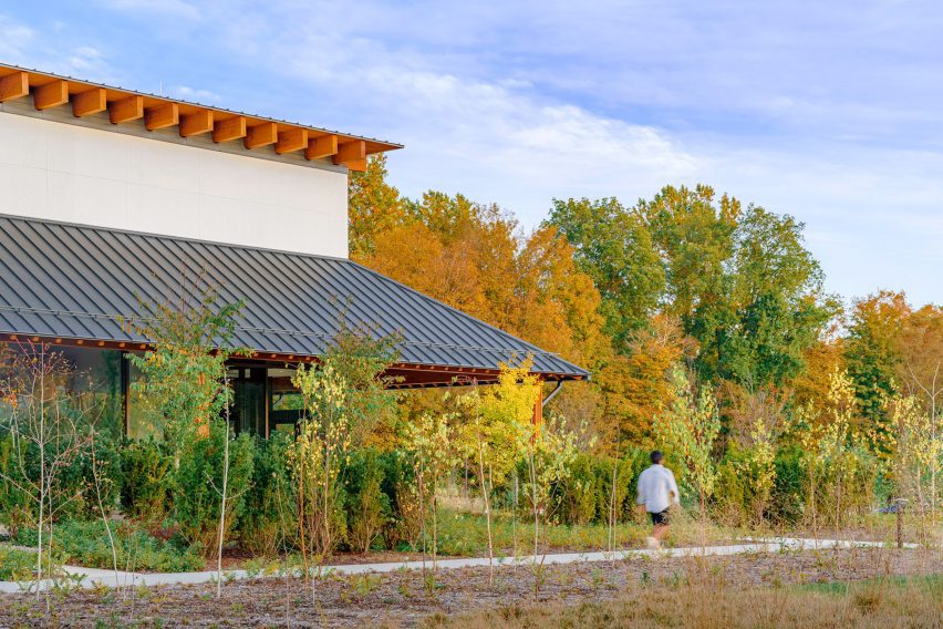 Person walking in front of building