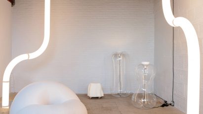 Room with white furniture and tubular lights