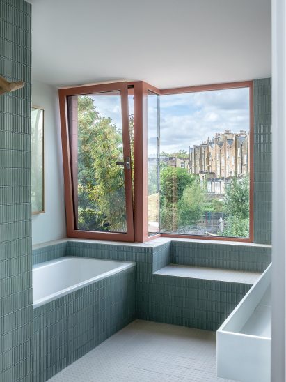 Blue-tiled bathroom of London home extension by Emil Eve Architects