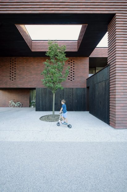Exterior courtyard within Frame house in Slovenia
