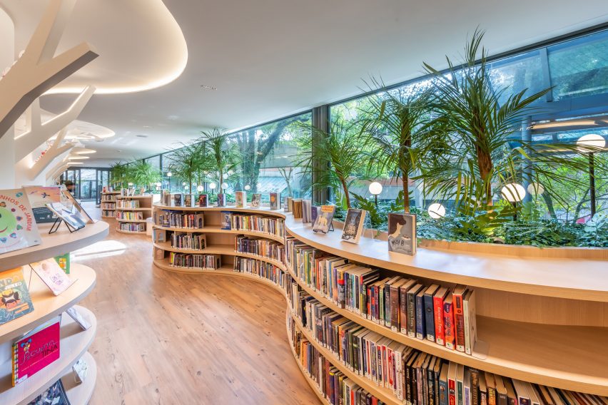 Wave bookshelves planted with fronds