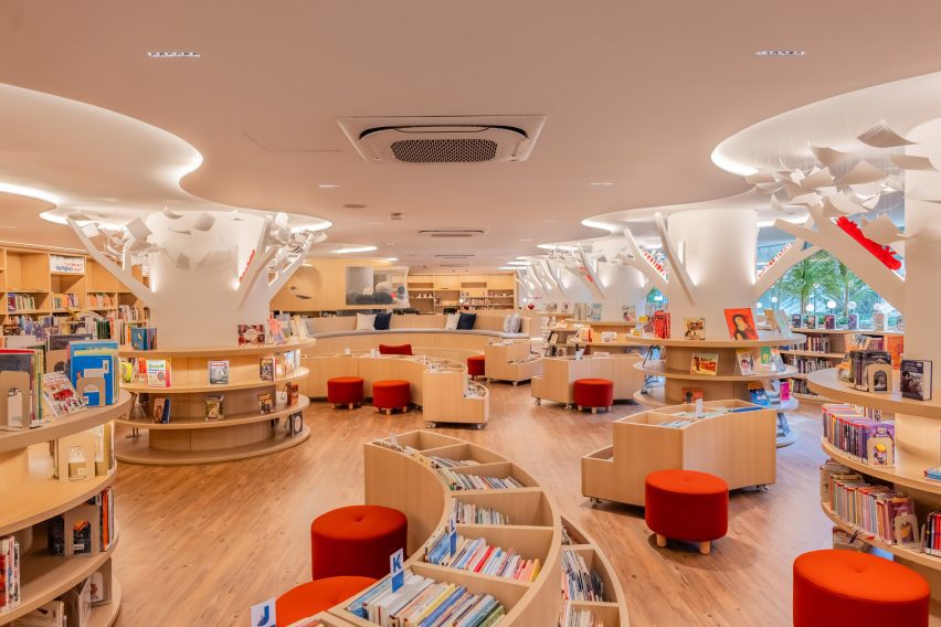 Wavy and circular bookshelves in library