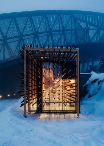 Glass museum extension covered by a wooden frame
