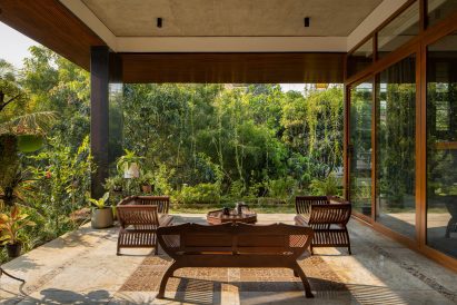 Balcony in a home surrounded by greenery