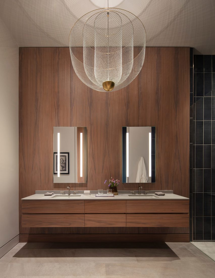 bathroom with wood walls