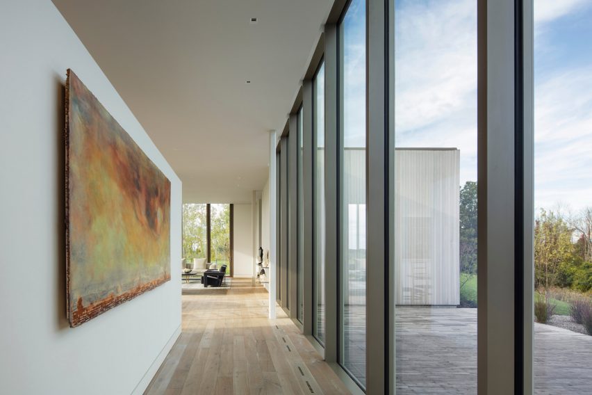 A long hallway with glass siding