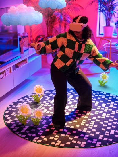 Girl using VR headset on a rug by IKEA