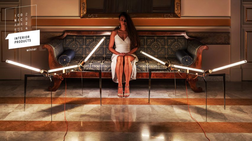 Photo of a person sitting on a sofa in a modern interior
