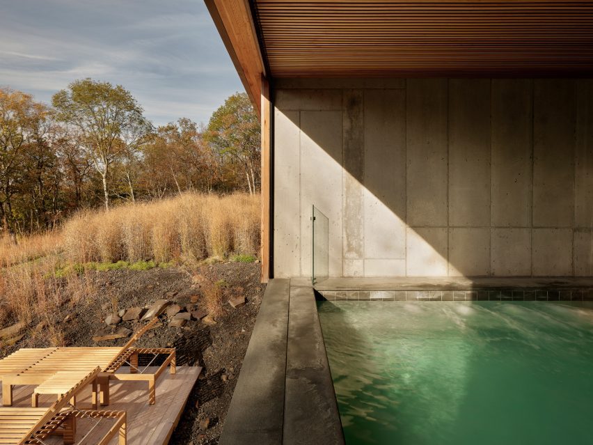 Pool with lounge chairs in front