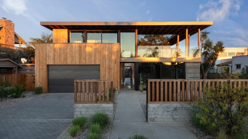 House with wooden garage and large windows
