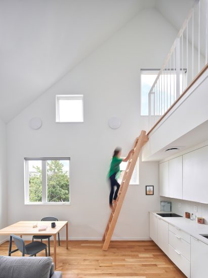 Woman climbing up ladder