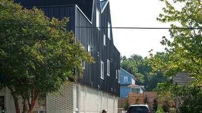 Person walking by house